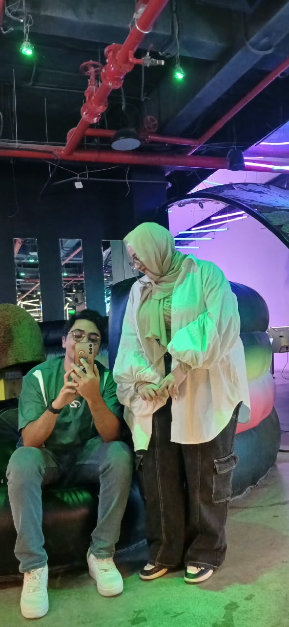 Touqa and Mohamed at the arcade